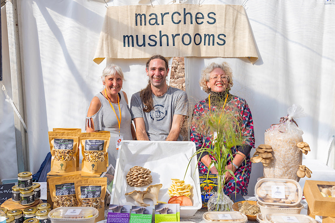 Our array of fresh and dried mushrooms, some being demonstrated growing straight from the hemp substrate. There are seasonings also made from mushrooms and the proud stallholder with the judges awarding the stall an award.
